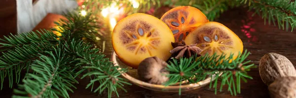 Christmas Still Life Slices Fresh Persimmon Fir Tree Walnuts Star — Stock Photo, Image