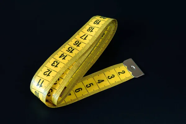Yellow Measuring Tape Black Background Slim Waist Concept Shallow Depth — Stock Photo, Image