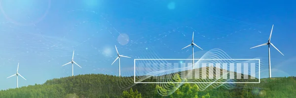 风力涡轮机与数字可视化的风和电池充电蓝色天空 绿色可再生能源的概念 风力发电场以无害环境的方式生产清洁能源 图库照片