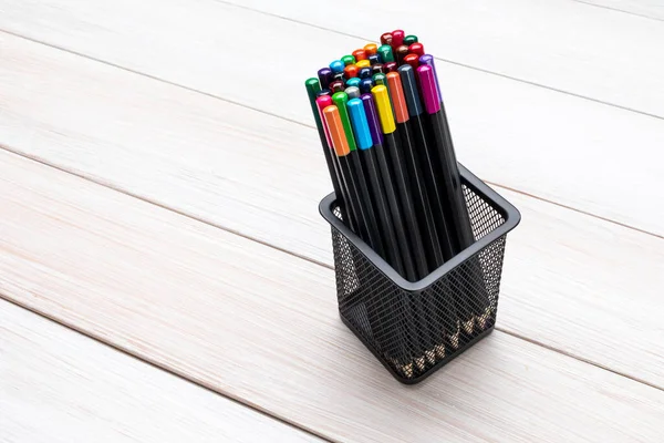 Office Colored Pens for Kids on a Black Background Stock Image