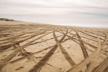 Tire tracks on sandy beach. Oceano Dunes, California Central Coast, the only California State Park that allows  vehicles to drive on the beach