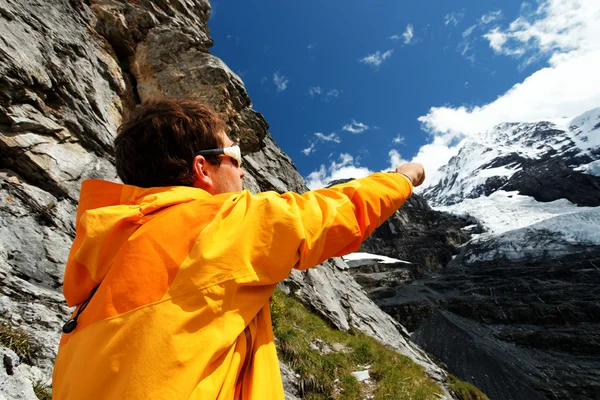 Alpinist contemplating the Eiger Glacier, Switzerland — Stock Photo, Image