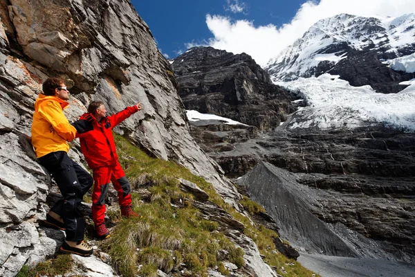 Alpinists contemplating the Eiger Glacier, Switzerland — Stock Photo, Image