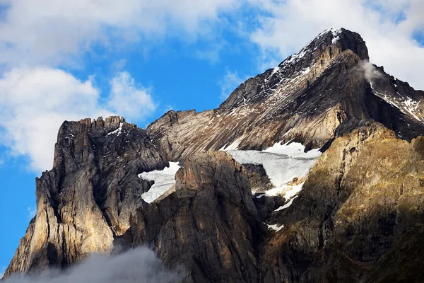 Wetterhorn Peak (3692m) over Grindelwald village, Switzerland Stock Image