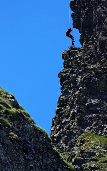 Climbing alpinist — Stock Photo, Image