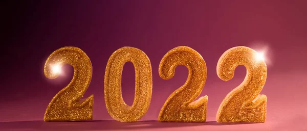 New Year banner with golden sparkling number 2022 against violet background. — Stock Photo, Image
