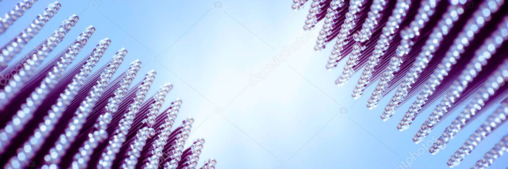Abstract background of metallic details of pintles against blue sky background. Banner with space for text.