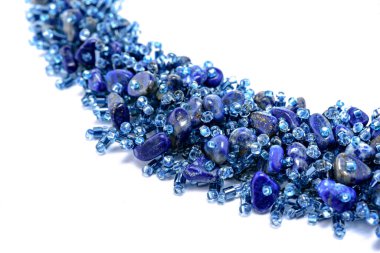 Blue Luxurious Handmade necklace of small glass beads with natural stones on white. Fashionable stylish festive and casual Jewelry accessory decoration for women.