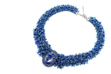 Blue Luxurious Handmade necklace of small glass beads with natural stones on white. Fashionable stylish festive and casual Jewelry accessory decoration for women.