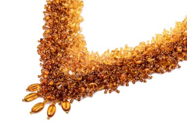 Amber Yellow Orange Luxurious Handmade necklace of small glass beads with natural stones on white. Fashionable stylish festive and casual Jewelry accessory decoration for women.