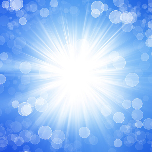 Sun on blue sky with lenses flare