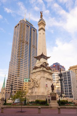 Indianapolis, Indiana, USA - October 19, 2021: The Indiana State Soldiers and Sailors Monument Next to the Salesforce Tower as seen on Monument Cir street