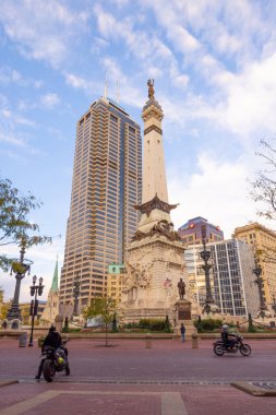 Indianapolis, Indiana, USA - October 19, 2021: The Indiana State Soldiers and Sailors Monument Next to the Salesforce Tower as seen on Monument Cir street