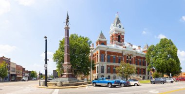 Princeton, Indiana, USA - August 24, 2021: The Gibson County Courthouse and it is war memorial