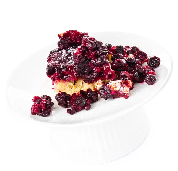 Piece of fresh fruit pie with powdered sugar on white background — Stock Photo, Image