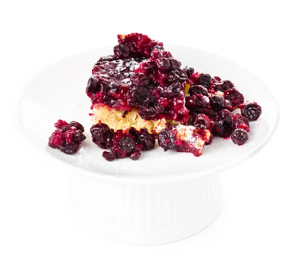 Piece of fresh fruit pie with powdered sugar on white background — Stock Photo, Image