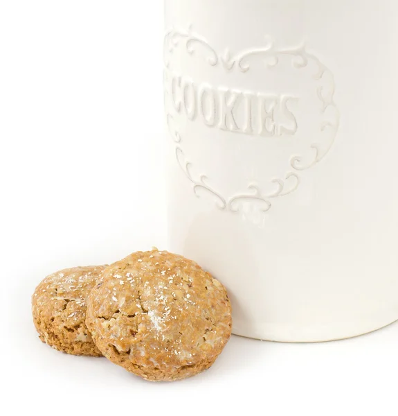 Oatmeal cookies and box on white — Stock Photo, Image