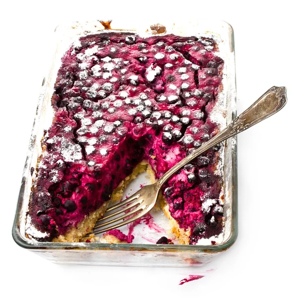 Side up and close view of fresh blueberry pie cut in half to show filling on white — Stock Photo, Image