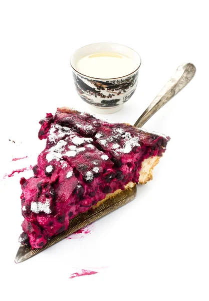 Side up and close view of fresh blueberry pie cut in half to show filling on white background — Stock Photo, Image