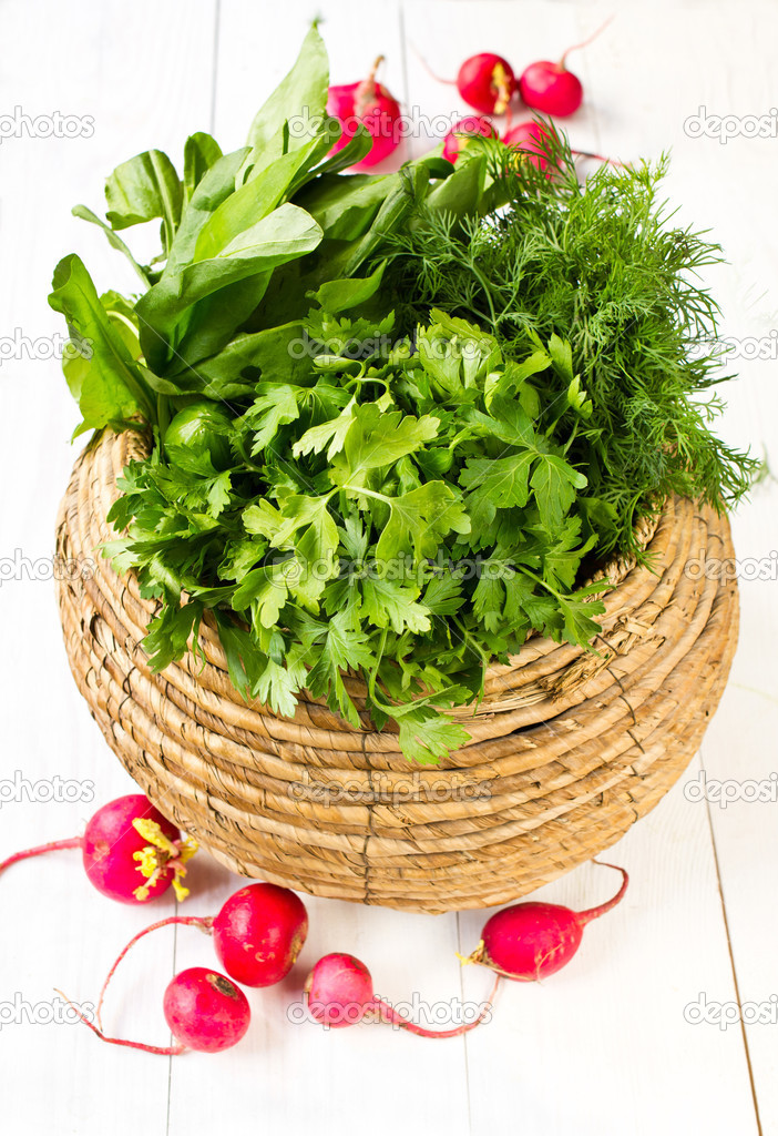 Fresh vegetables in a bowl wicker basket on white