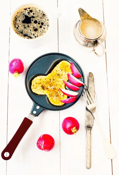 Fried eggs in fun form of penis in a frying pan with coffee — Stock Photo, Image