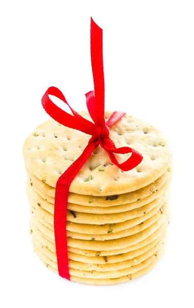 Salty cookies tied with red ribbon isolated on white background — Stock Photo, Image