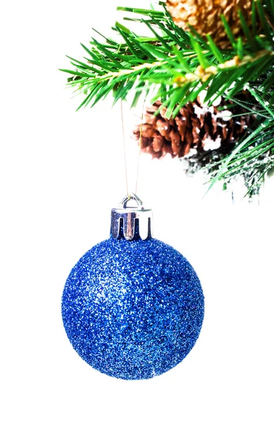 Christmas shiny blue ball on fir branches with decorations — Stock Photo, Image