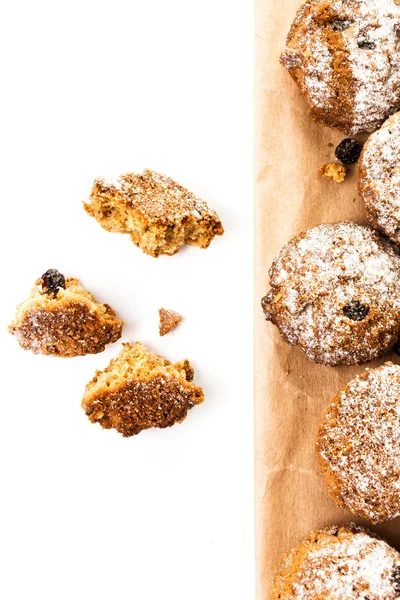 Pile of chocolate chips small cookies on brown paper parchament on white background. — Stock Photo, Image