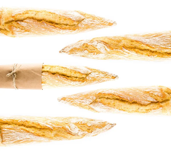 French Crusty Baguette of whole wheat bread on a white background — Stock Photo, Image