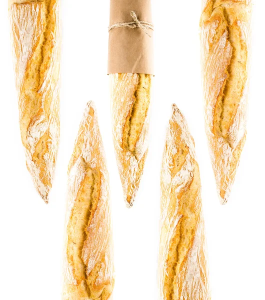 French Crusty Baguette of whole wheat bread on a white background — Stock Photo, Image