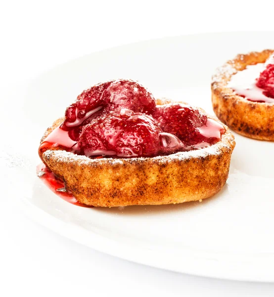 Dessert fruit cake with strawberry on a white plate isolated. — Stock Photo, Image