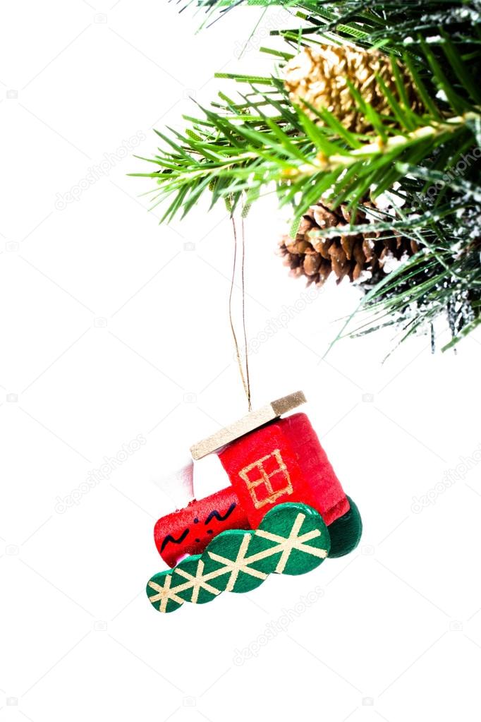 Christmas colorful small train on fir branches with snow decorations