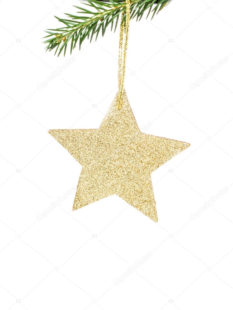 Christmas shiny golden star on fir branches with decorations