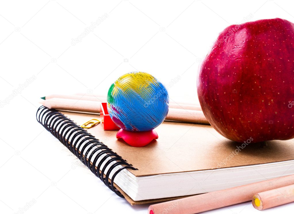 School supplies with Globe and notebook on white background.