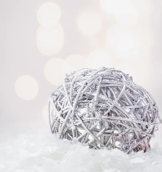 Christmas composition with silver bauble and snow — Stock Photo, Image