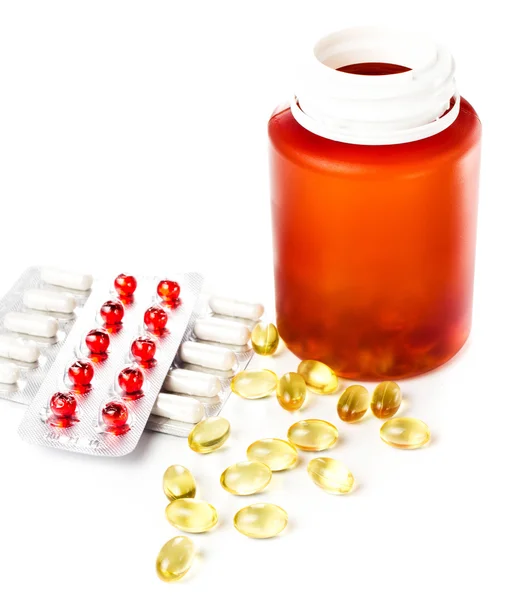 Pílulas medicamentosas que saem do frasco da pílula com embalagens blister — Fotografia de Stock