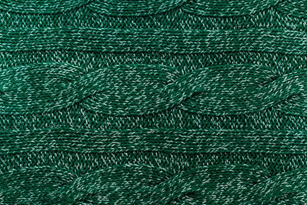 Вязанный трикотаж зеленый фон с рельефным рисунком — стоковое фото