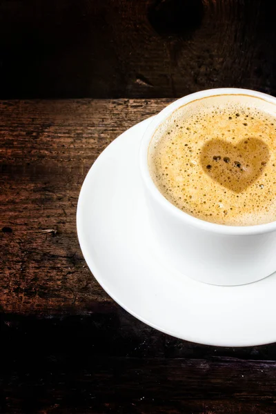 Cup of espresso on old wooden table — Stock Photo, Image