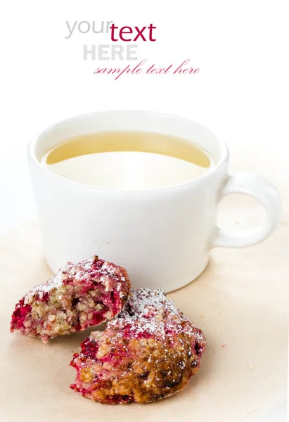 Homemade raspberries cookie with oatmeal and cup of green tea Stock Picture