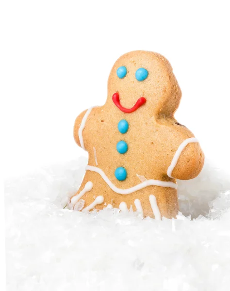 Gingerbread man julen cookie i snow — Stockfoto