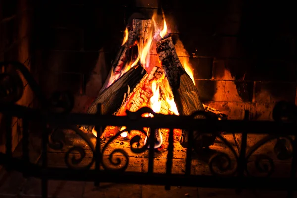 Home Fire burning in brick fireplace. — Stock Photo, Image