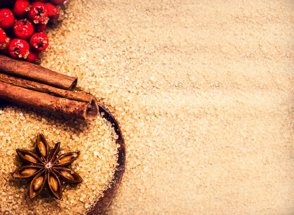 Christmas background with Brown sugar, anise star and cinnamon — Stock Photo, Image