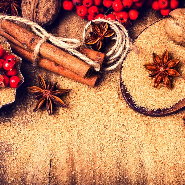 Christmas background with Brown sugar, anise star and cinnamon sticks — Stock Photo, Image