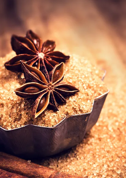 Brown sugar and Star Anise in baking tray on wooden table — Stock Photo, Image