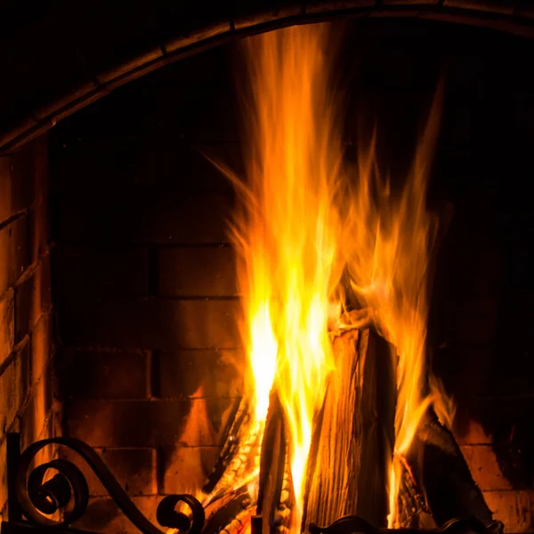 Home Fire burning in brick fireplace. — Stock Photo, Image