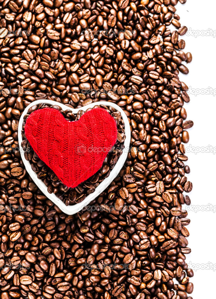Roasted Coffee Beans with Red Heart over coffee beans background