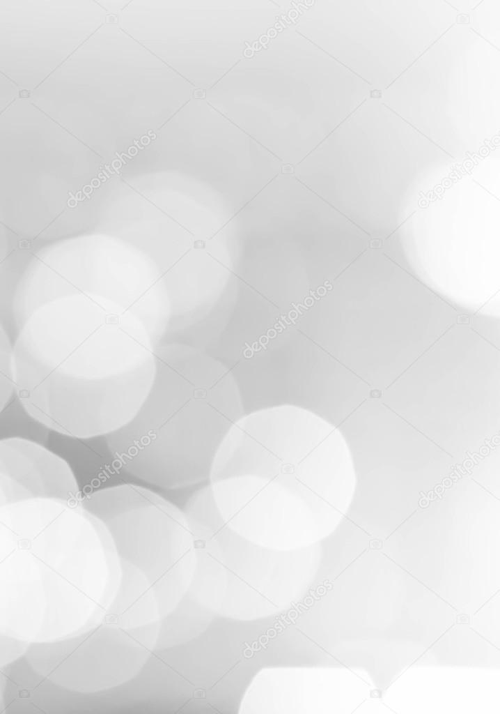 Light silver abstract Christmas background with glowing magic bokeh