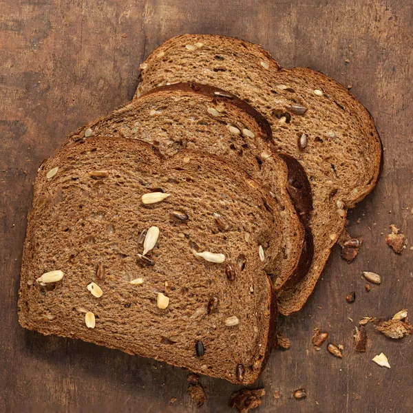 Top View Sliced Wholegrain Bread Dark Ructic Wooden Background Closeup — Stock Photo, Image