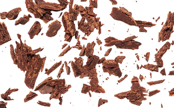 Beyaz Arka Planda Izole Edilmiş Izgara Çikolata Parçaları Ezilmiş Koyu — Stok fotoğraf