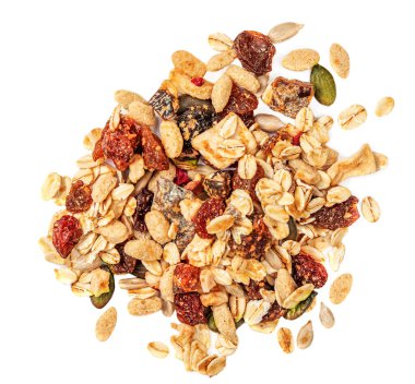 Fındıklı yulaf gevrekleri, tohumlar ve beyaz arka planda izole edilmiş kuru meyveler. Granola Flat yatıyordu. Üst yaşam